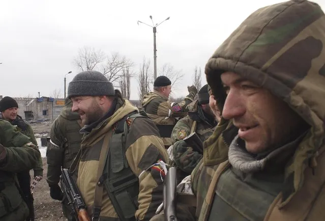 Pro-Russia rebels smile in Debaltseve, eastern Ukraine on Thursday, February 19, 2015. (Photo by Peter Leonard/AP Photo)