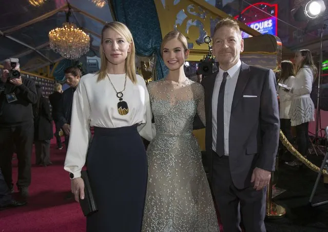 Director of the movie Kenneth Branagh poses with cast members Cate Blanchett and Lily James (C) at the premiere of "Cinderella" at El Capitan theatre in Hollywood, California March 1, 2015. The movie opens in the U.S. on March 13. REUTERS/Mario Anzuoni  (UNITED STATES - Tags: ENTERTAINMENT)