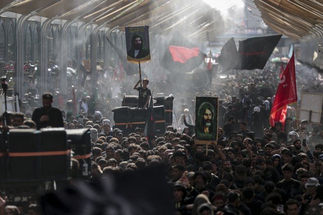Shiite pilgrims mark the holiday of Arbaeen on Tuesday, September 5, 2023, in Karbala, Iraq. The holiday marks the end of the forty-day mourning period after the anniversary of the martyrdom of Imam Hussein, the Prophet Muhammad's grandson, in the 7th century. (Photo by Anmar Khalil/AP Photo)