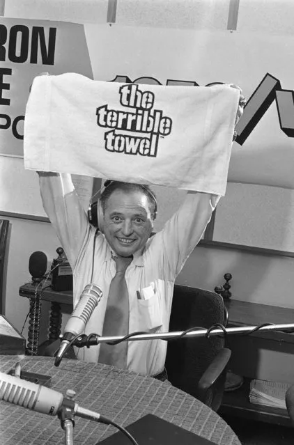 Pittsburgh sportscaster Myron Cope shows a Terrible Towel, a Cope brainchild that has become a marketing success, in Pittsburgh, Pa., December 27, 1979. The towel, which is supposed to give almost supernatural powers to the Steelers, will be in the hands of thousands of Steeler faithful when they face the Miami Dolphins. (Photo by AP Photo)