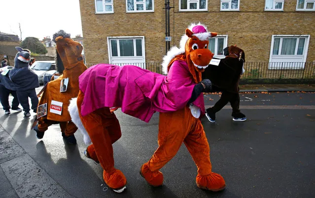 Participants take part in the annual London Pantomime Horse Race in Greenwich London, Britain, December 16, 2018. (Photo by Henry Nicholls/Reuters)