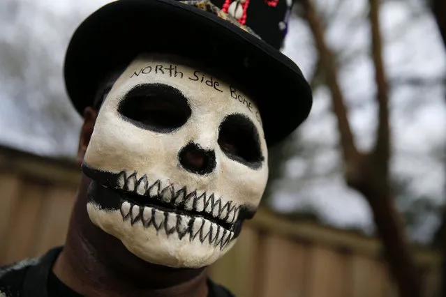 Bruce “Sunpie” Barnes, head of the Mardi Gras North Side Skull & Bone Gang, poses with his accoutrements for upcoming Mardi Gras day, in New Orleans, Tuesday, February 2, 2016. Their costumes are intended to represent the dead, and Barnes said they bring a serious message, reminding people of their mortality and the need to live a productive and good life. (Photo by Gerald Herbert/AP Photo)