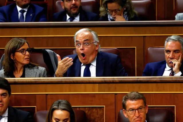 Spain's People's Party deputy Esteban Gonzalez Pons reacts while Prime Minister Pedro Sanchez speaks during the investiture debate as Spain's Socialists seek to clinch a new term following a deal with the Catalan separatist Junts party for government support, a pact which involves amnesties for people involved with Catalonia's failed 2017 independence bid, in Madrid, Spain on November 15, 2023. (Photo by Susana Vera/Reuters)