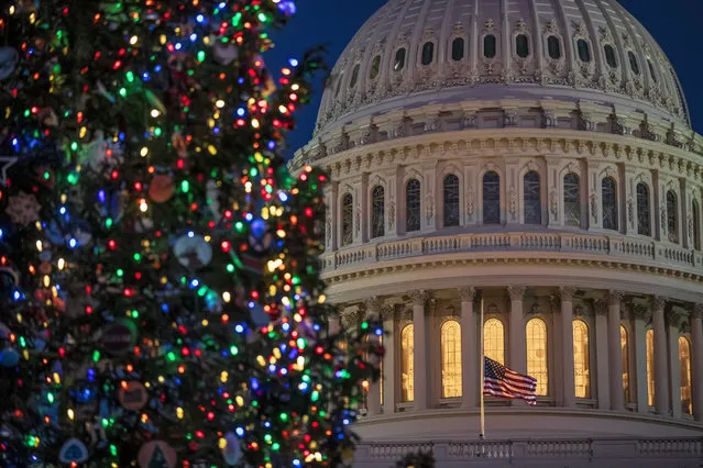 The Capitol is seen at twilight in Washington, Monday, December 17, 2018. The fight over President Donald Trump's $5 billion wall funds deepened Monday, threatening a partial government shutdown in a standoff that has become increasingly common in Washington. (Photo by J. Scott Applewhite/AP Photo)