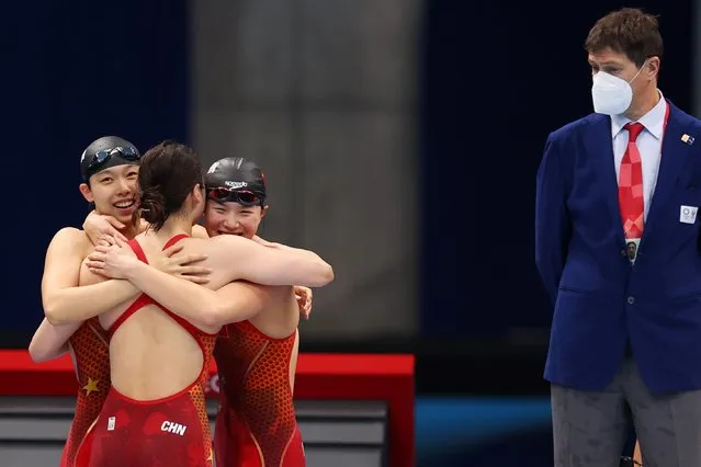 Yang Junxuan, Tang Muhan and Zhang Yufei of Team China celebrate after winning the Women's 4 x 200 m Freestyle Relay Final on day six of the Tokyo 2020 Olympic Games at Tokyo Aquatics Centre on July 29, 2021 in Tokyo, Japan. (Photo by Marko Djurica/Reuters)