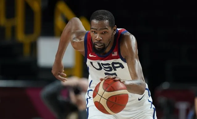 United States' Kevin Durant (7) chases the ball during men's basketball gold medal game against France at the 2020 Summer Olympics, Saturday, August 7, 2021, in Saitama, Japan. (Photo by Charlie Neibergall/AP Photo)