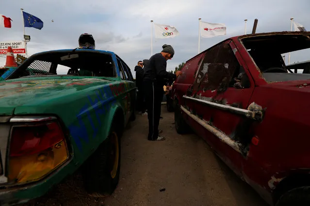 A driver decorates his car before taking part in a demolition derby organised by the Malta Motor Sports Association to raise funds for charity in Ta' Qali, outside Valletta, Malta, January 8, 2017. (Photo by Darrin Zammit Lupi/Reuters)