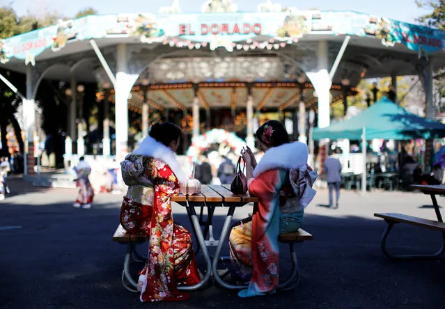 Japanese women wearing kimonos attend their Coming of Age Day celebration ceremony at Toshimaen amusement park in Tokyo, Japan January 14, 2019. (Photo by Issei Kato/Reuters)