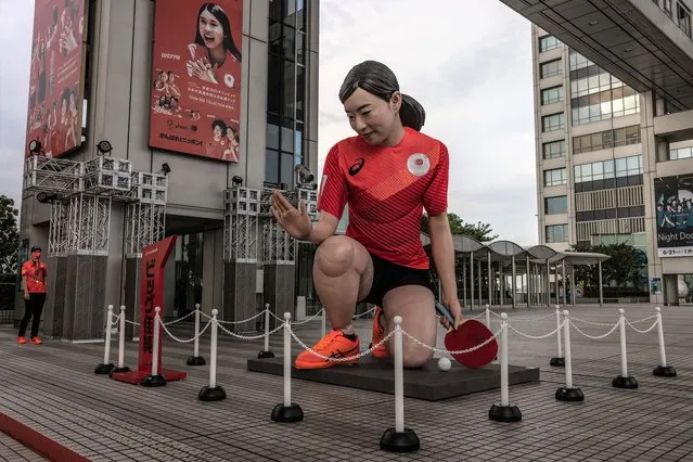 A giant statue of Japanese Olympic table-tennis player Kasumi Ishikawa is displayed outside the Fuji TV headquarters on July 30, 2021 in Tokyo, Japan. Japans Prime Minister Yoshihide Suga claimed on Thursday that there is no link between the recent surge in the number of coronavirus infections in Japan and the Tokyo Olympics, which is approaching the end of its first week. Tokyo has seen day-on-day record increases in Covid-19 infection rates over the last three days causing concern amongst officials in Tokyo. (Photo by Carl Court/Getty Images)