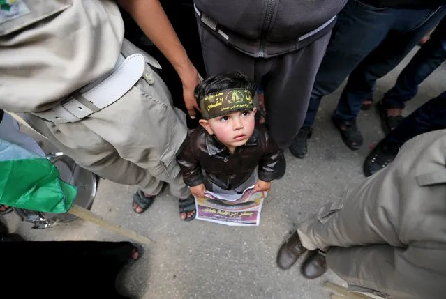 A Palestinian boy attends a rally marking Palestinian Prisoners' Day organised by Islamic Jihad movement in Khan Younis in the southern Gaza Strip April 17, 2015. (Photo by Ibraheem Abu Mustafa/Reuters)