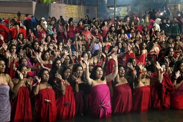 Hindu devotees bathe in the Shali river for a prosperous conjugal life as a ritual of the Swasthani Brata Katha festival, on the outskirts of Kathmandu on January 25, 2024. (Photo by Prakash Mathema/AFP Photo)