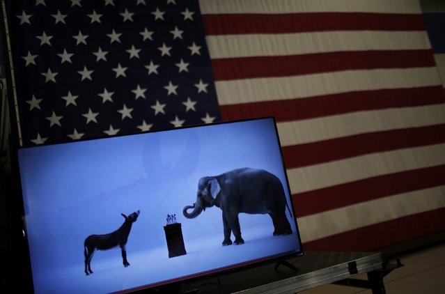 The mascots of the Democratic and Republican parties, a donkey for the Democrats and an elephant for the GOP, are seen on a video screen at Democratic U.S. presidential candidate Hillary Clinton's campaign rally in Cleveland, Ohio March 8, 2016. (Photo by Carlos Barria/Reuters)