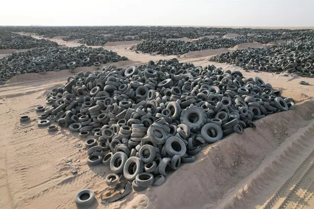 An aerial view of the tyre graveyard where disposed tyres stored as the landfill threatens the environment and human health due to containing dangerous components and tyre durability at a tyre graveyard located 160 kilometers away from the capital Kuwait City, in al Salmi area, Kuwait on August 12, 2021. Kuwaiti government seeks solution to get rid of disposed tyres which have been accumulated for about 20 years. (Photo by Faisal Alnomas/Anadolu Agency via Getty Images)