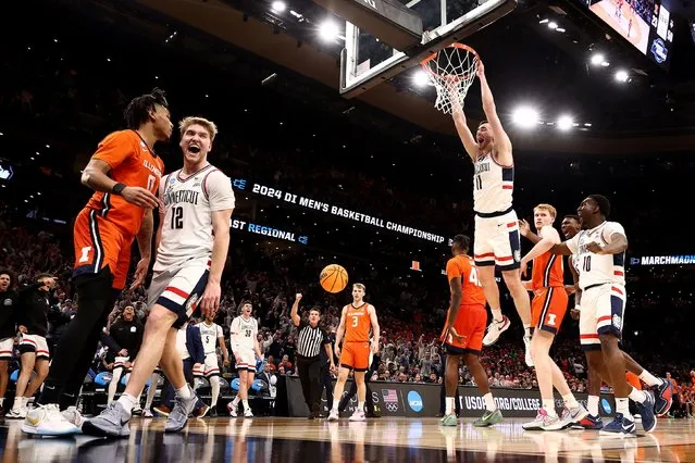 Alex Karaban #11 of the Connecticut Huskies dunks the ball against the Illinois Fighting Illini during the second half in the Elite 8 round of the NCAA Men's Basketball Tournament at TD Garden on March 30, 2024 in Boston, Massachusetts. (Photo by Maddie Meyer/Getty Images)