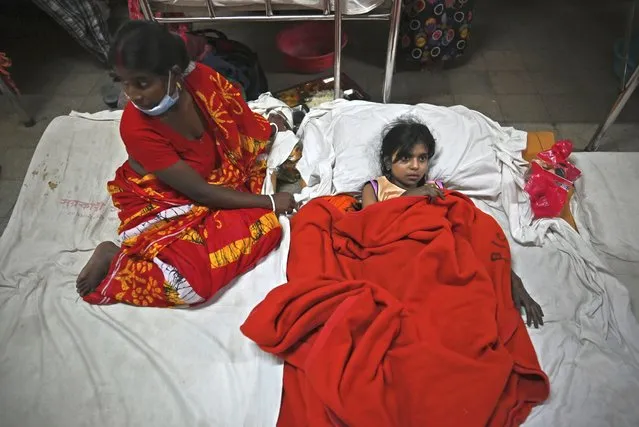 A girl rescued from a ferry fire gets treated at a government medical hospital, in Barishal, Bangladesh, Friday, December 24, 2021. (Photo by Niamul Rifat/AP Photo)