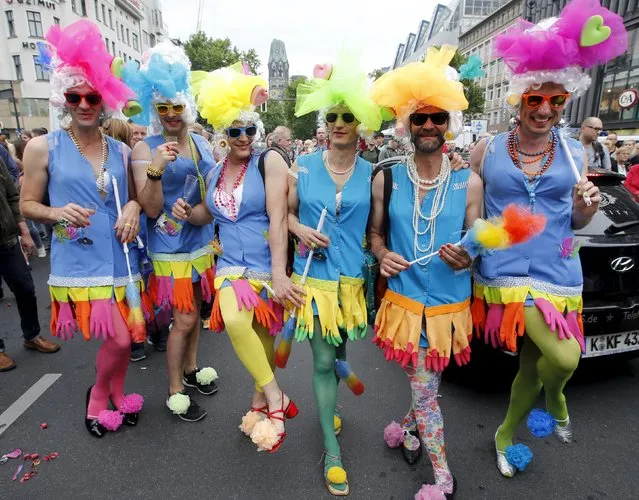 People participate in colourful costumes at the annual Christopher Street Day parade on Kurfuerstendamm in Berlin, Germany, June 27, 2015. (Photo by Fabrizio Bensch/Reuters)
