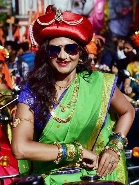 A woman dressed in traditional Marathi attire participates during the Gudi Padwa celebrations in Mumbai on Tuesday. The festival which marks the beginning of Hindu new year is widely observed in Maharashtra and Konkan region, India on Tuesday, March 28, 2017. (Photo by Santosh Hirlekar/Press Trust of India)