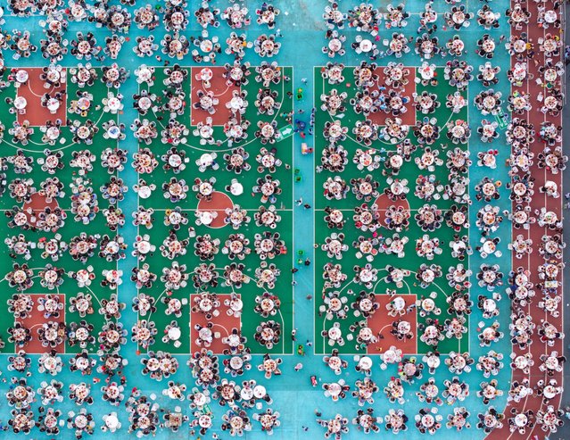 A large number of citizens and tourists are tasting crayfish at a lobster banquet in Huai'an, China, on June 13, 2024. (Photo by Costfoto/NurPhoto/Rex Features/Shutterstock)