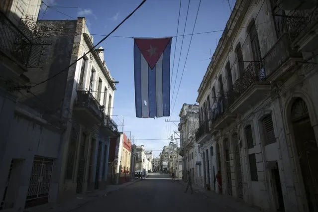 A Cuban flag hangs on the street in downtown Havana, Cuba, April 18, 2016. Picture taken April 18, 2016. (Photo by Alexandre Meneghini/Reuters)