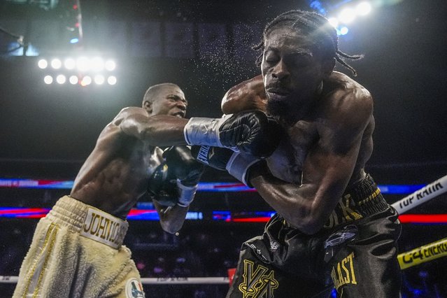 Kevin Johnson, left, punches Kelvin Davis, right, during the fourth round of a welterweight boxing match Saturday, July 6, 2024, in Newark, N.J. Davis won the fight. (Photo by Frank Franklin II/AP Photo)