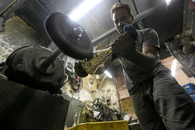 A worker manufacturing primus stoves known as “Bagour” in Arabic, in Cairo, Egypt, May 11, 2016. (Photo by Mohamed Abd El Ghany/Reuters)