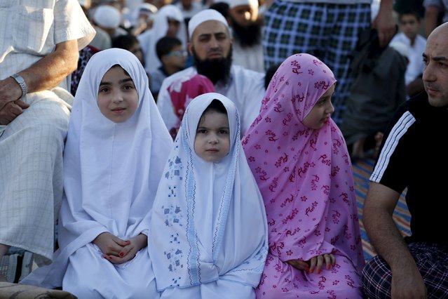 Muslims perform prayers for Eid-al Fitr to mark the end of the holy fasting month of Ramadan in Amman, Jordan, July 17, 2015. (Photo by Muhammad Hamed/Reuters)