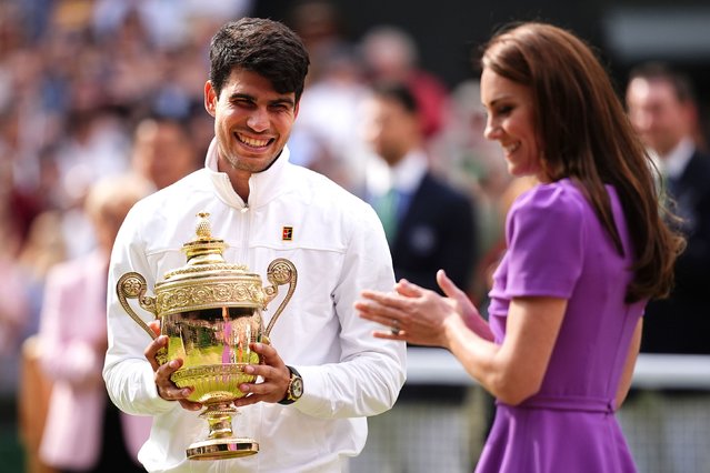 Wimbledon champion Carlos Alcaraz is presented with the trophy by Catherine, Princess of Wales after he defeated Novak Djokovic in straight sets on Sunday, July 14, 2024. It was only Kate’s second public appearance this year following her cancer diagnosis. (Photo by Aaron Chown/PA Wire)