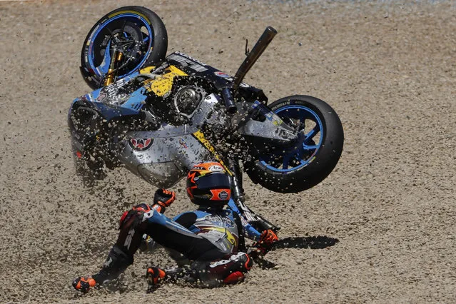 MotoGP rider Tito Rabat of Spain falls from his bike at the Spanish Motorcycle Grand Prix at the Jerez racetrack in Jerez de la Frontera, Spain, Sunday, May 7, 2017. (Photo by Miguel Morenatti/AP Photo)