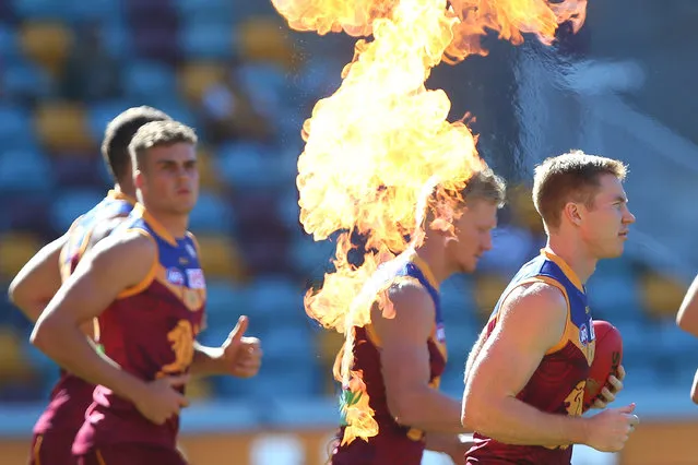 Lions runn out for the start of the round 10 AFL match between the Brisbane Lions and the Hawthorn Hawks at The Gabba on May 28, 2016 in Brisbane, Australia. (Photo by Chris Hyde/Getty Images)