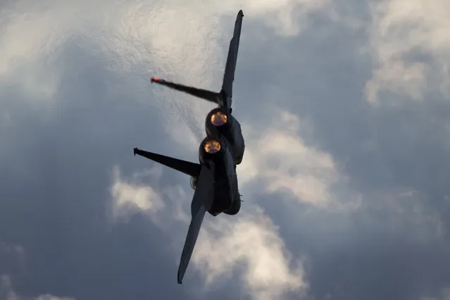 This Thursday, December 29, 2016 photo shows Israeli Air Force F-15 plane fly during a graduation ceremony for new pilots in the Hatzerim air force base near the city of Beersheba, Israel. Anti-aircraft missiles were launched from Syria into Israeli-controlled territory early on Friday, following a series of Israeli airstrikes inside Syria, the Israeli military said. The military said its warplanes struck several targets in Syria and were back in Israeli-controlled airspace when several anti-aircraft missiles were launched from Syria toward the Israeli jets. (Photo by Ariel Schalit/AP Photo)