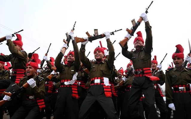 Newly recruited Indian army soldiers from the Jammu and Kashmir Light Infantry (JAKLI) celebrate during a passing out parade at JAKLI army headquarter in Srinagar on December 7, 2019. (Photo by Tauseef Mustafa/AFP Photo)