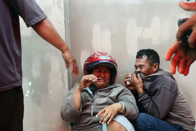 Relatives weep at a hospital after learning that their family members are among the victims of a speedboat that sank off Tarakan, North Kalimantan, Indonesia, Tuesday, July 25, 2017. (Photo by AP Photo/Albar)