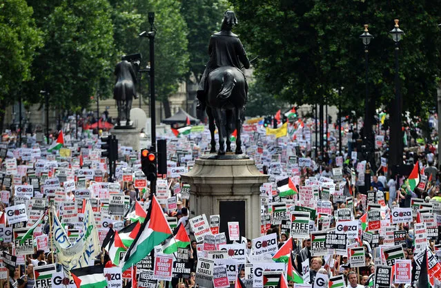 Tens of thousands of pro-Palestinian demonstrators march up Whitehall towards the Israeli embassy during a protest in London, Britain, 19 July 2014. (Photo by Andy Rain/EPA)