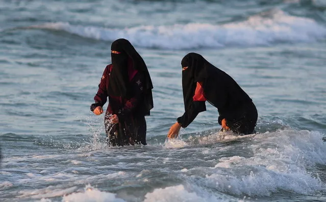 Palestinians enjoy the beach in Gaza City on June 8, 2022. (Photo by Mohammed Salem/Reuters)