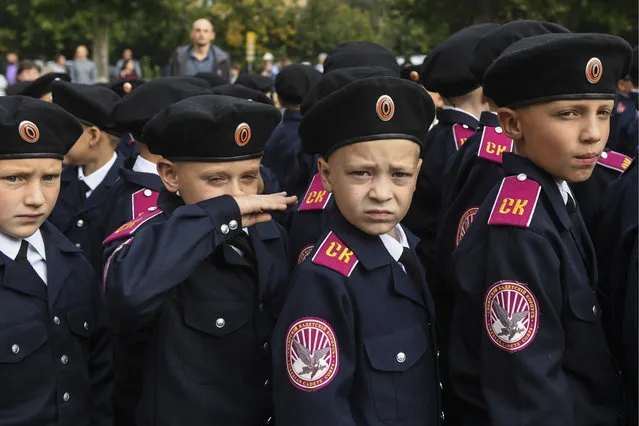 Cadets of the Siberian military school attend a ceremony marking Knowledge Day on September 1, 2017 in Novosibirsk, Russia. The holiday marks the beginning of a new school year in Russia and is celebrated on September 1. (Photo by Kirill Kukhmar/TASS)