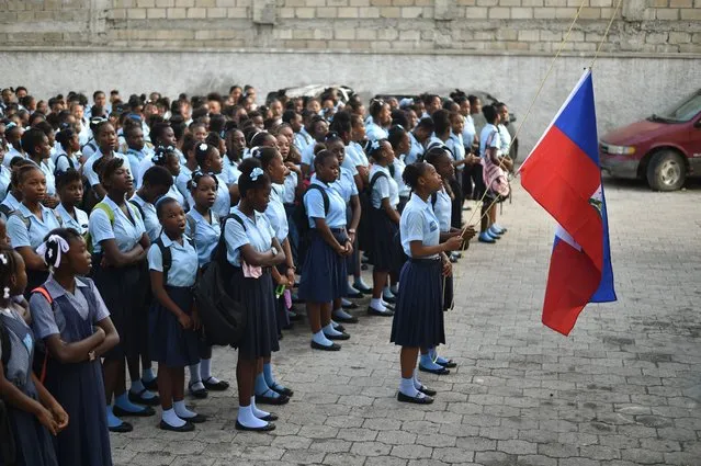 Students prepare for the first day of school school at the Lycee du Cent Cinquantatenaire, in Port-au-Prince, on September 4, 2017. (Photo by Hector Retamal/AFP Photo)