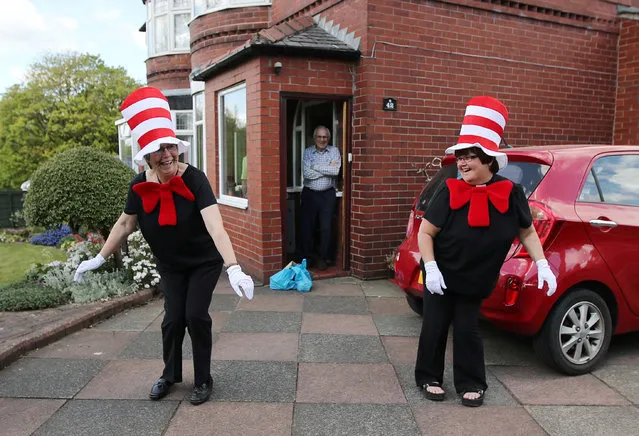 Viv and Carol from St James' church, dressed as the character Cat in the Hat, pose for a photograph as they deliver meals to vulnerable residents following the outbreak of the coronavirus disease (COVID-19), Bolton, Britain, April 27, 2020. (Photo by Molly Darlington/Reuters)