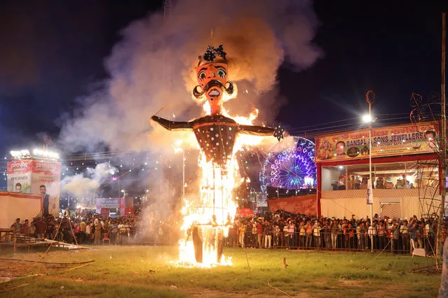 Fireworks explode as an effigy of Meghnad, son of demon king Ravana, burns during Vijaya Dashmi or Dussehra festival celebrations in the old quarters of Delhi, India on October 5, 2022. (Photo by Anushree Fadnavis/Reuters)