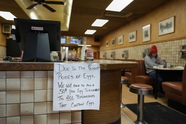 A sign is posted at the register read “Due to the recent price of eggs, we will have to add a .50 cent per egg surcharge to all breakfasts that contain eggs”. at the Pepper Pod Restaurant, Thursday, February 13, 2025, Newport, Ky. (Photo by Carolyn Kaster/AP Photo)