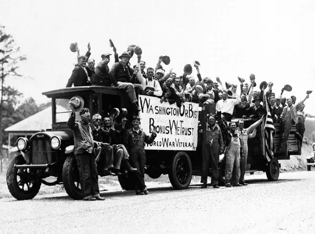 This group of unemployed veterans of the World War left Columbus, Ga., and Girard, Ala., Wednesday, June 1 on a long trek to Washington to demand payment of the soldier's bonus. They were photographed June 2, 1932 near Lawrenceville, Ga. The men carried their own provisions and traveled in trucks. (Photo by AP Photo)