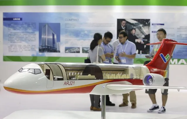 A model of the ARJ21 regional jet from Commercial Aircraft Corp of China (COMAC) is displayed at the Aviation Expo China 2015 in Beijing, China, September 16, 2015. Chinese state-owned plane maker COMAC said on Wednesday it has signed an initial agreement with lessor ICBC Financial Leasing Co to lease 10 COMAC ARJ21 regional jets and 10 of its C919 single-aisle commercial jets to Thai airline City Airways. (Photo by Jason Lee/Reuters)