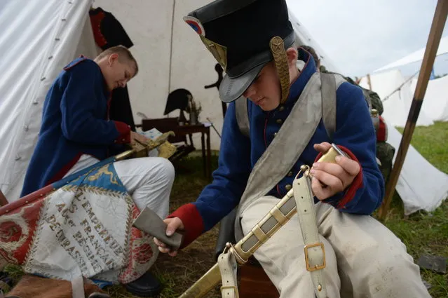 Participants in the Borodino Battle re-enactment before the show at the Borodino Field in the Moscow Region on September 4, 2016. The Battle of Borodino, fought on September 7, 1812, was a battle fought in the Napoleonic Wars during the French invasion of Russia. The fighting involved around 250,000 troops and left at least 70,000 casualties, making Borodino the deadliest day of the Napoleonic Wars. Napoleon's Grande Armée launched an attack against the Russian army, driving it back from its initial positions but failing to gain a decisive victory. (Photo by Kirill Kallinikov/Sputnik)