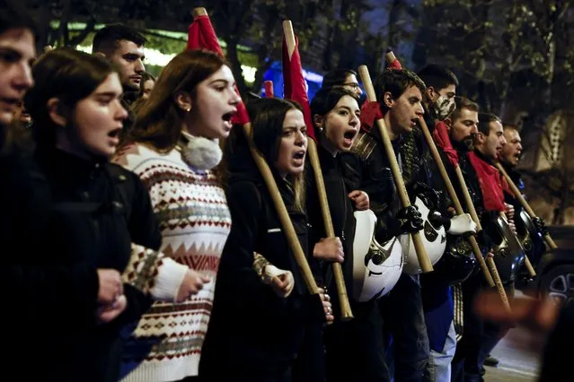 Protesters march during a protest rally following the death of a teenager, in northern city of Thessaloniki, on Tuesday, December 13, 2022. (Photo by Dimitris Tosidis/AP Photo)