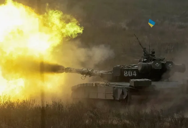 A tank fires during a military exercise in the training centre of Ukrainian Ground Forces near Goncharivske in Chernihiv region, Ukraine, September 10, 2016. (Photo by Gleb Garanich/Reuters)