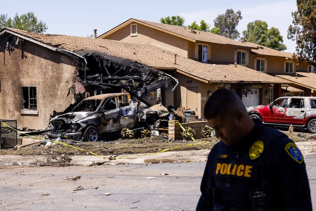 A house on a residential street that was damaged when a small airplane crashed into the area earlier this morning near Montgomery-Gibbs Executive Airport in San Diego, California, USA, 22 May 2025. According to a statement released by the Federal Aviation Administration, a Cessna 550 crashed around 3:45 am PST with an unknown number of people on board. A number of homes in the area were damaged by fire. (Photo by Caroline Brehman/EPA/EFE)