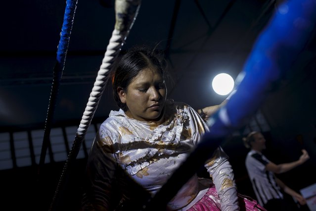 Bolivian wrestler Leonor Cordova, nicknamed Angela "La Simpatica" reacts during a wrestling bout against Yenny Mamani, nicknamed Martha "La Altena”, in Madrid, Spain, October 8, 2015. (Photo by Juan Medina/Reuters)