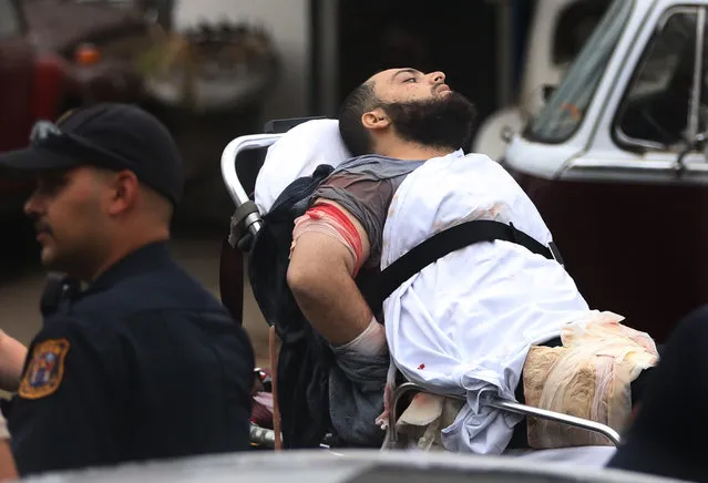 Ahmad Khan Rahami is taken into custody after a shootout with police Monday, September 19, 2016, in Linden, N.J. Rahami was wanted for questioning in the bombings that rocked the Chelsea neighborhood of New York and the New Jersey shore town of Seaside Park. (Photo by Ed Murray/NJ Advance Media via AP Photo)