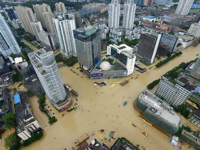 An aerial view shows flooded intersections following the landfall of Typhoon Megi in Fuzhou in southeastern China's Fujian Province, Wednesday, September 28, 2016. The massive typhoon made landfall in eastern China Wednesday, a day after carrying strong winds over Taiwan that felled trees and scattered debris, killing several people and injuring hundreds. (Photo by Chinatopix via AP Photo)