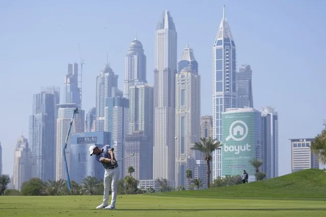 Rory McIlroy of Northern Ireland plays his second shot on the 13th hole during the final round of the Dubai Desert Classic, in Dubai, United Arab Emirates, Monday, January 30, 2023. (Photo by Kamran Jebreili/AP Photo)