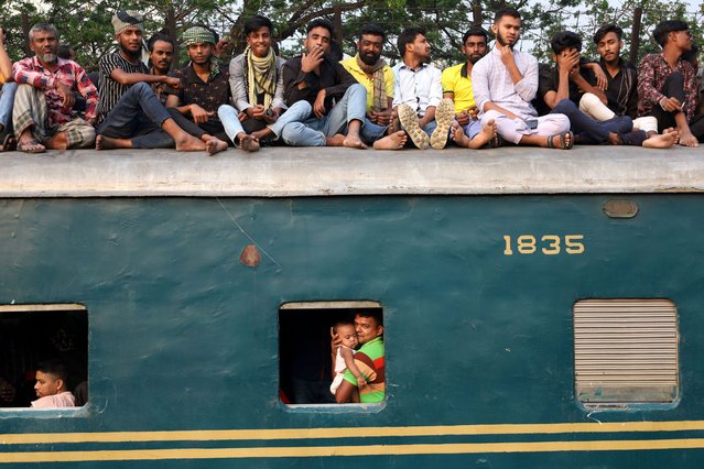 Commuters at Joydevpur railway station in Gazipur Bangladesh on April 9, 2024 struggle to travel in overcrowded trains to celebrate the upcoming holy Eid-ul-fitr 2024 holiday with their families. Generally, when the garment holiday starts before Eid, there is maximum passenger pressure on trains due to insufficient number of vehicles. Passengers want to reach home by any means possible to share their joy with their loved ones. (Photo by Syed Mahabubul Kader/ZUMA Press Wire/Rex Features/Shutterstock)